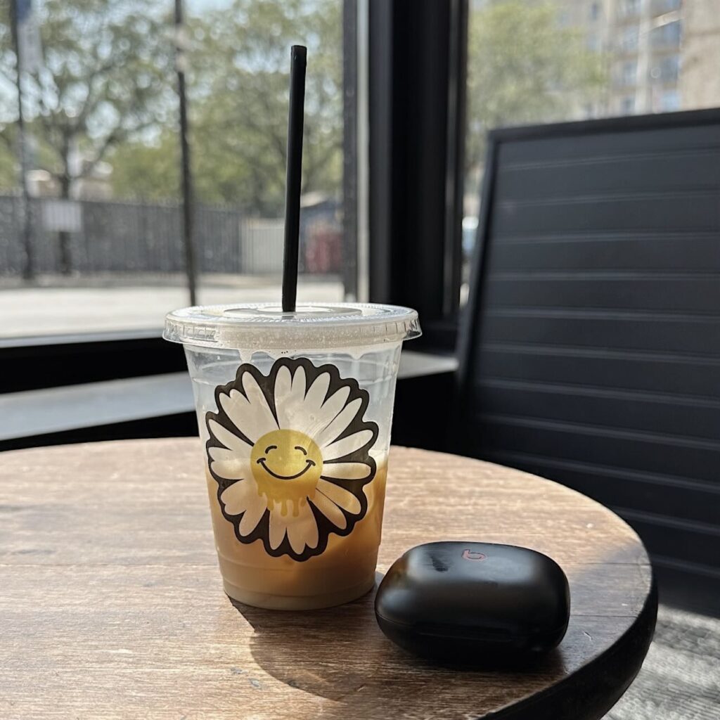 coffee cup with a smiley face sticker on it to show how your summer morning routine ought to be :)